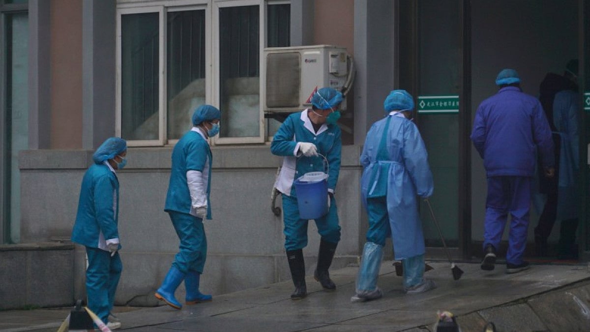Hospital staff at the emergency entrance of Wuhan Medical Treatment Center