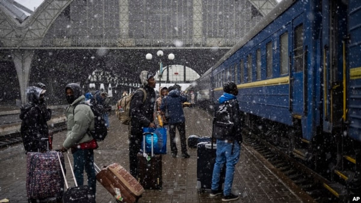 Nigerian students in Ukraine wait at the platform in Lviv railway station in Lviv, west Ukraine.