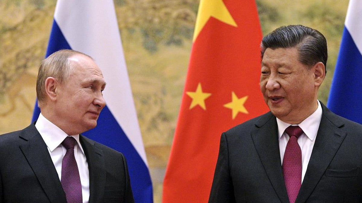 Russia's Vladimir Putin and China's Xi Jinping in conversation on the eve of Beijing Olympics