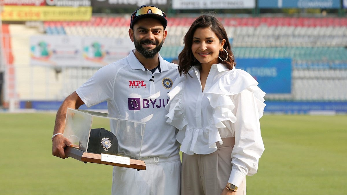 Virat Kohli and wife Anshuka Sharma pose during the facilitation ceremony for the 100th Test.