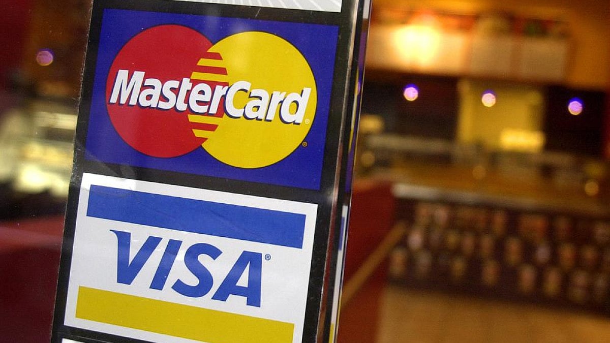 File photo shows logos for MasterCard and Visa credit cards in New York, US. coffee shop.