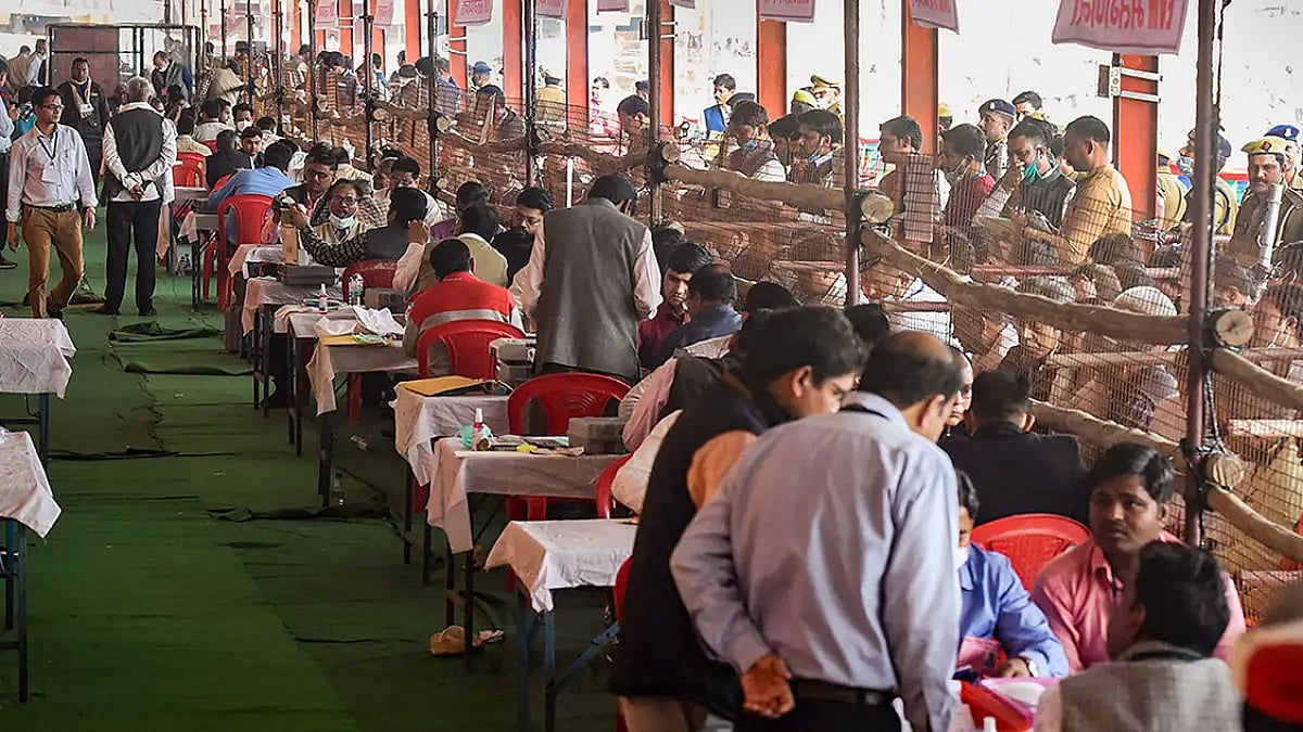 Polling staff during counting day of Uttar Pradesh Assembly elections, at a counting centre in Aliga
