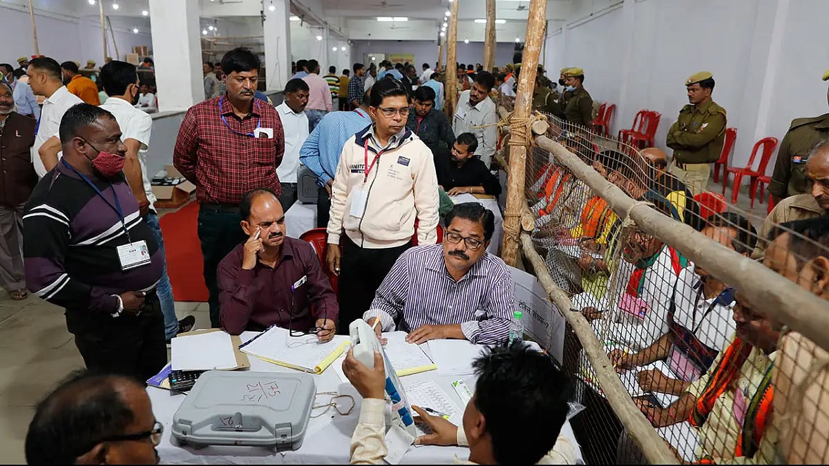 Election officials count votes after Uttar Pradesh state elections in Lucknow.