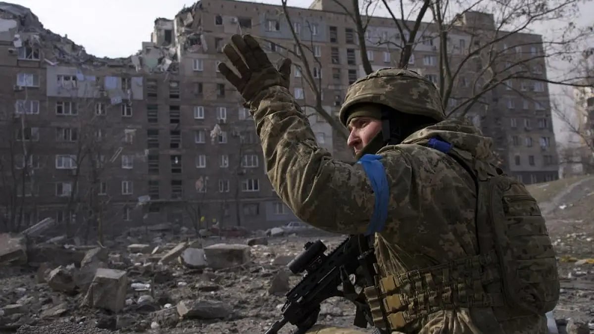 A Ukrainian serviceman guards his position in Mariupol, Ukraine.