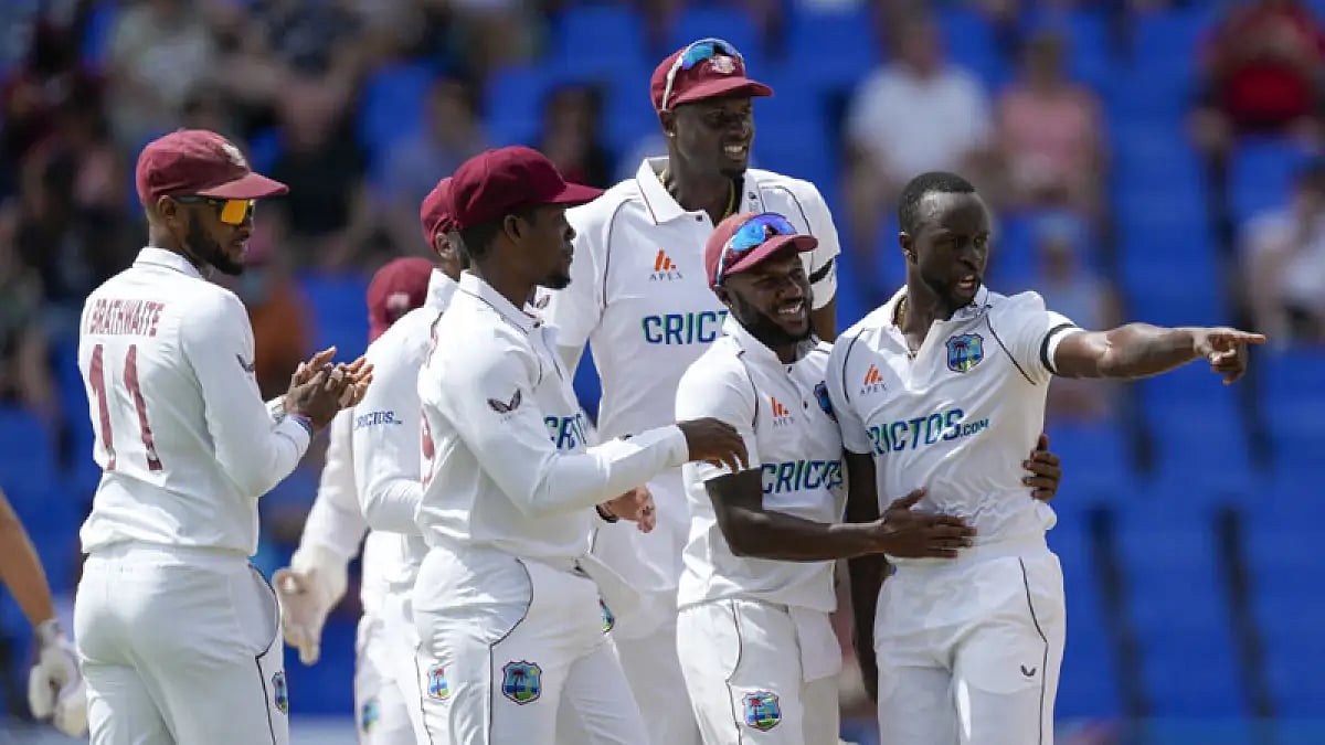 West Indies players celebrate England captain Joe Root's wicket on Day 1 of the first Test.
