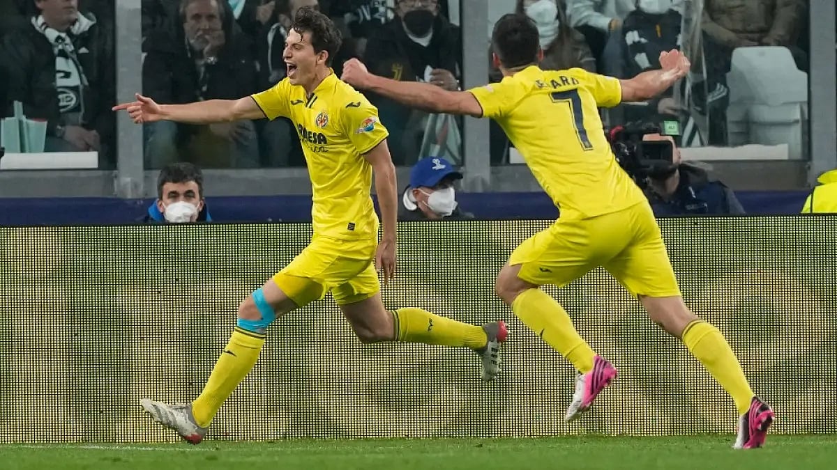 Villarreal's Pau Torres (L) celebrates after scoring against Juventus in UEFA Champions League.