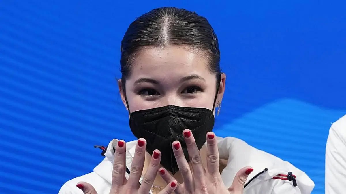 Alysa Liu reacts after competing at the Beijing Winter Olympics.