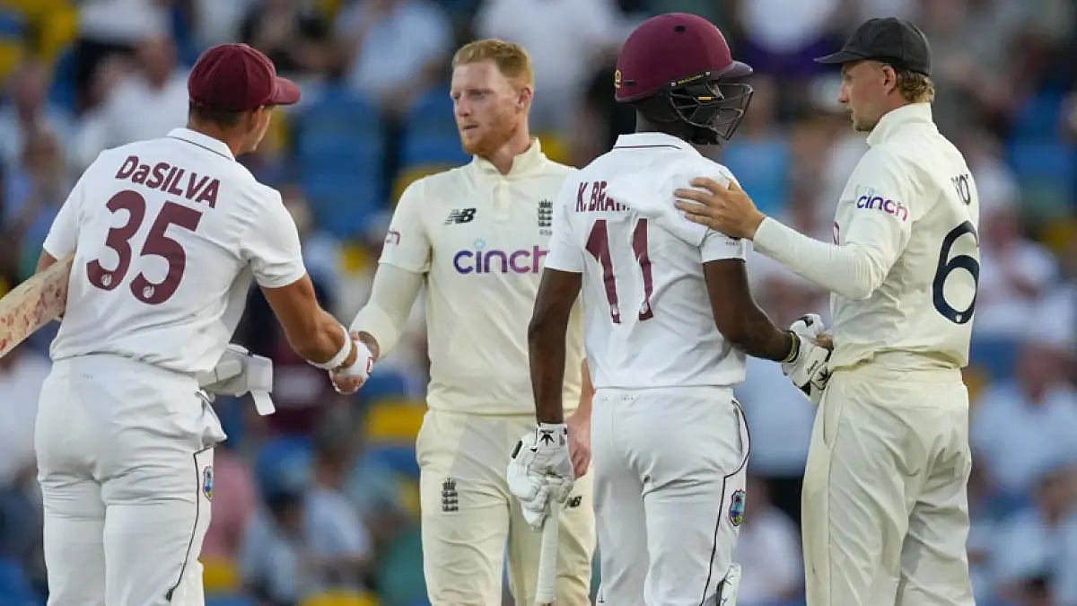 West Indies and England players shake hands at the end of day five of their second Test match.