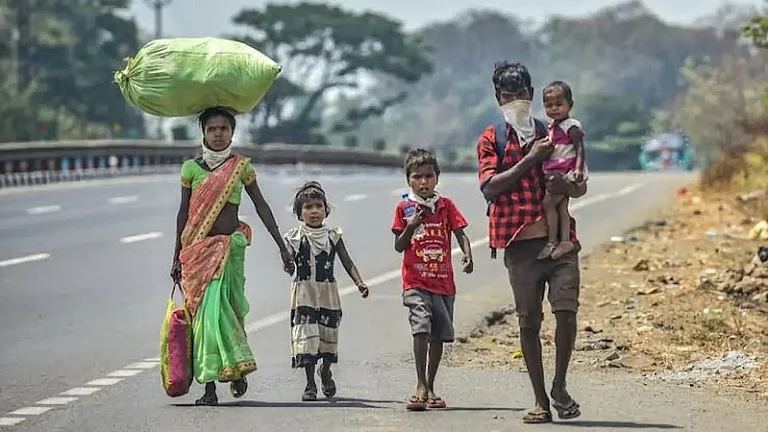 Migrant workers walking homr following the March 24, 2020, lockdown - null