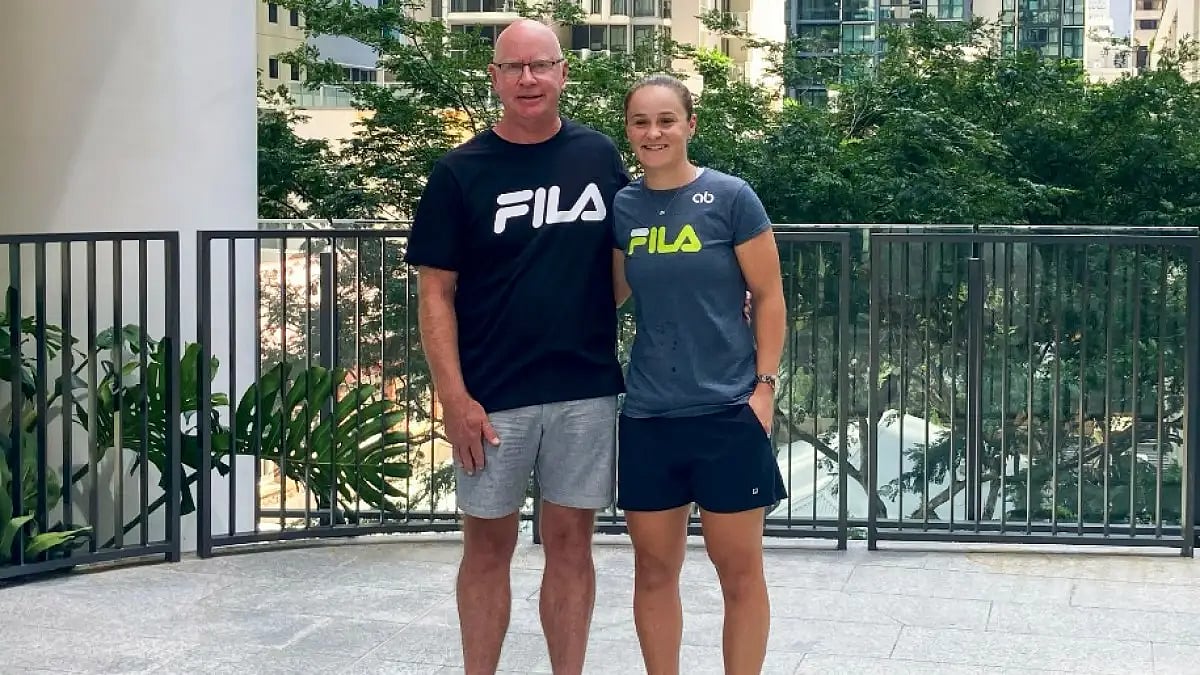 Ashleigh Barty (R) stands with her coach Craig Tyzzer during a press conference in Brisbane.