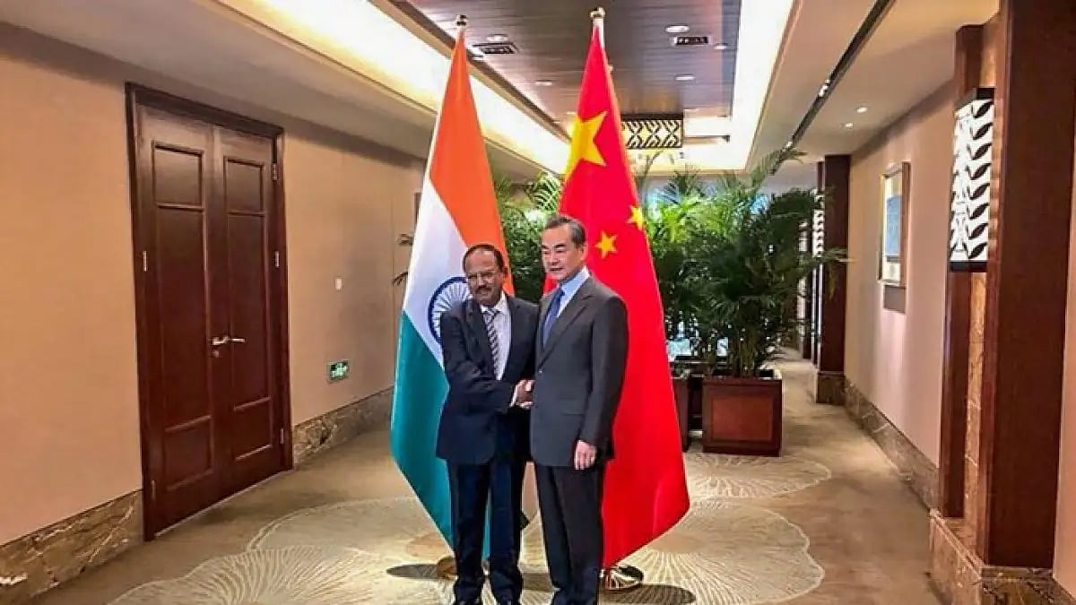 National Security Adviser Ajit Doval with China's FM Wang Yi in New Delhi. 