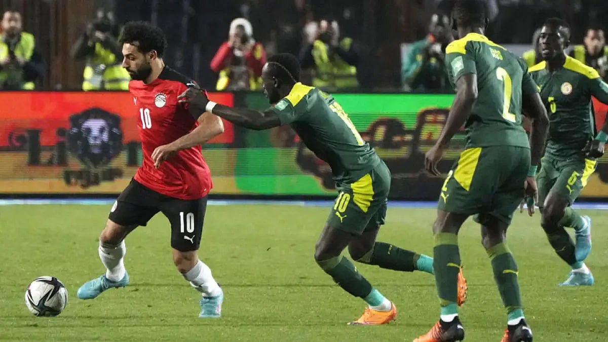 Senegal's Sadio Mane, tries to catch Egypt's Mohamed Salah, during a FIFA World Cup 2022 qualifier.