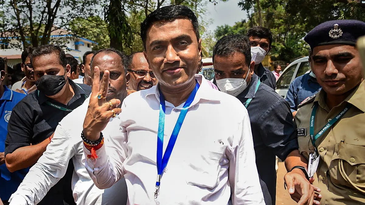 Pramod Sawant flashes the victory signs after assembly election results 