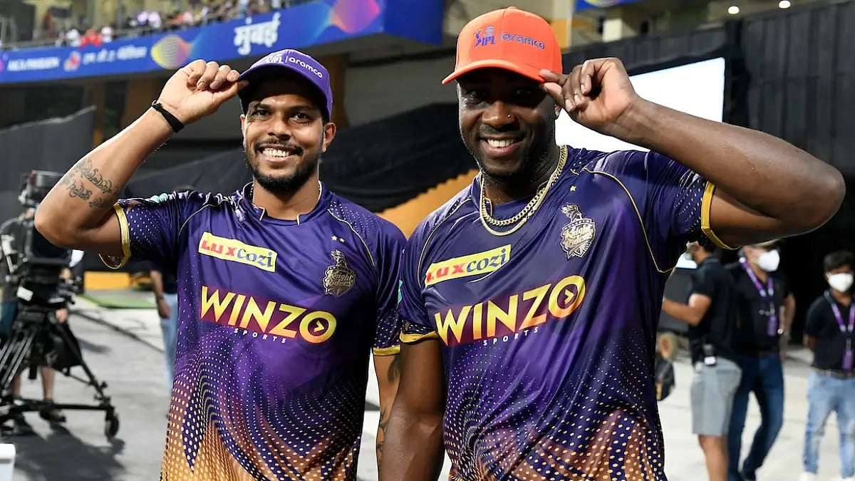 KKR's Andre Russell and Umesh Yadav flaunt their Orange and Purple Caps respectively on Friday.