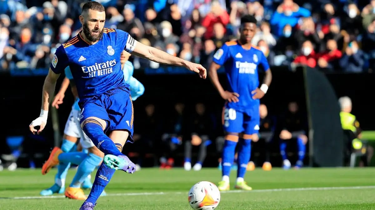 Real Madrid's Karim Benzema scores from the spot against Celta Vigo in La Liga.