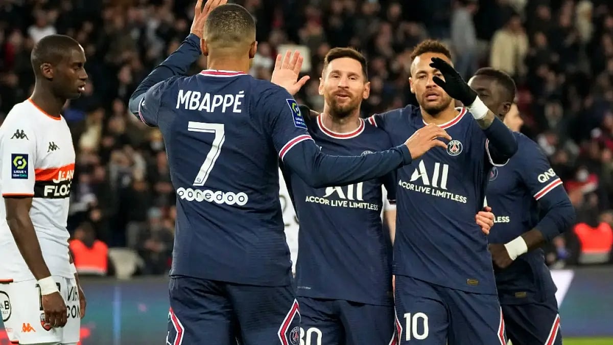 Lionel Messi celebrates with Neymar and Kylian Mbappe after scoring in PSG's win over Lorient.