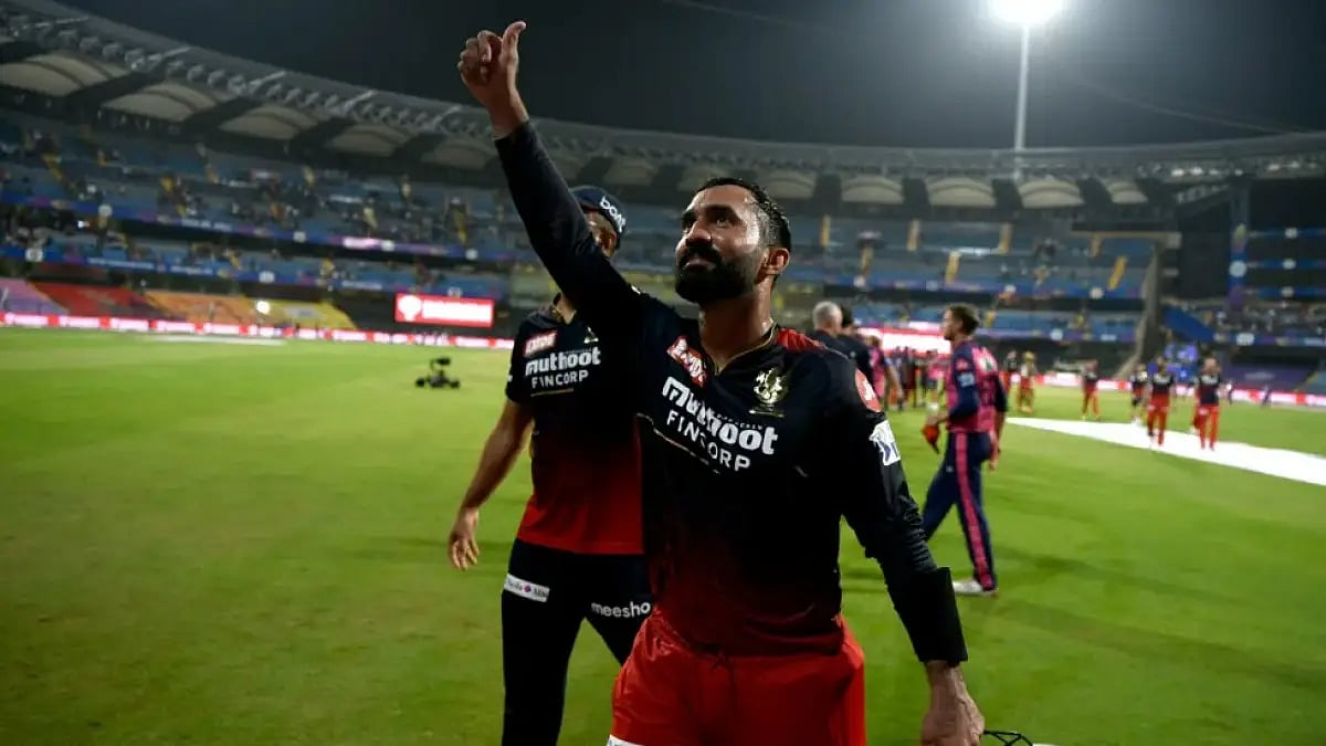 Dinesh Karthik gestures towards the crowds after helping RCB over the line against RR in IPL 2022.