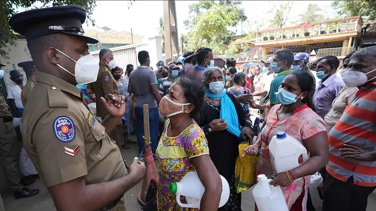 Sri Lankans at a fuel station amid acute fuel shortage