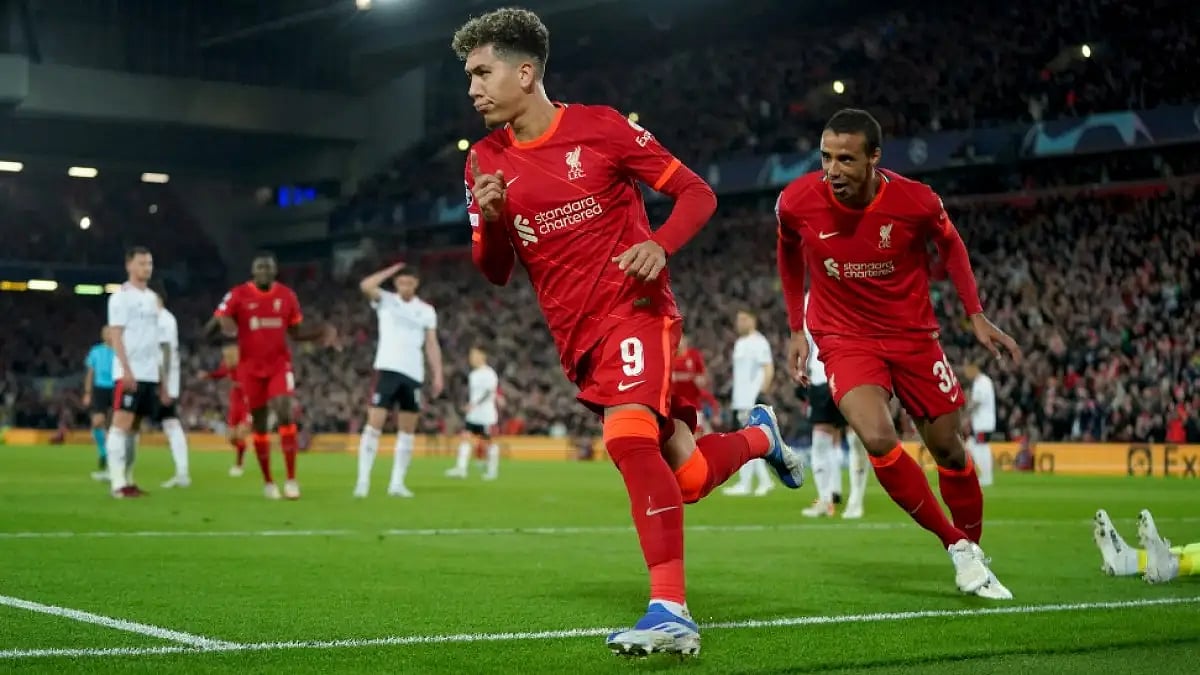 Liverpool's Roberto Firmino celebrates after scoring against Benfica in UCL quarterfinals.