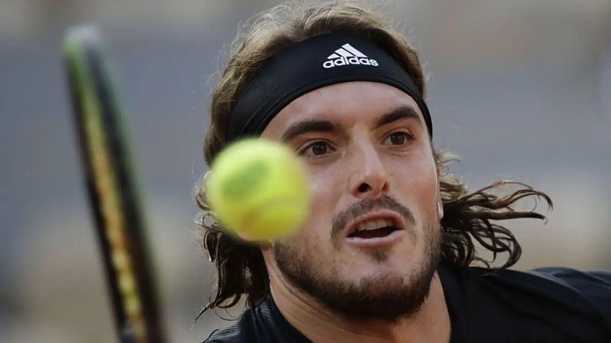 Defending champion Stefanos Tsitsipas advanced by beating Laslo Djere 7-5, 7-6 (1).