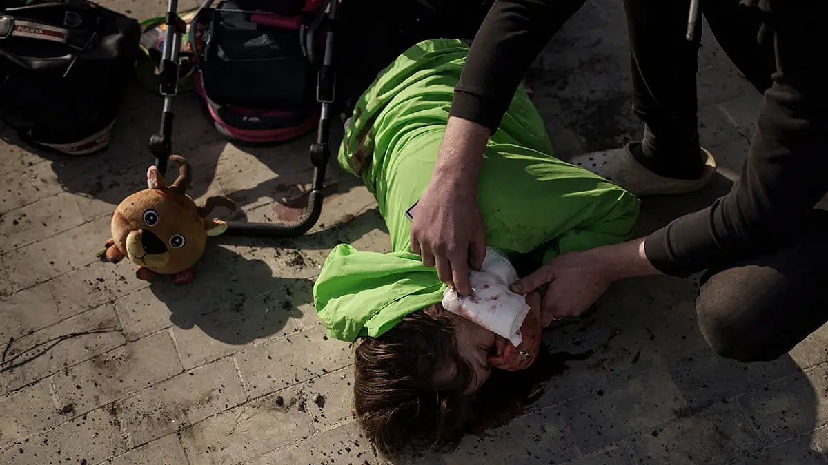 Smashed Buildings In Mariupol Produce 'Caravan Of Death'