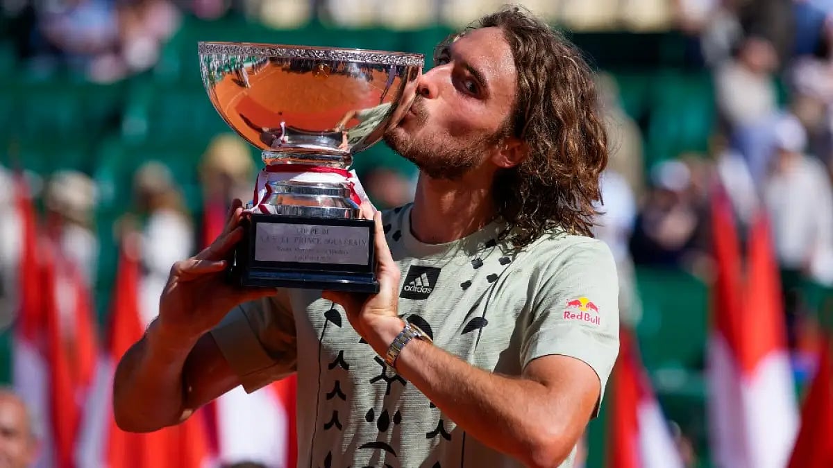 Stefanos Tsitsipas kisses Monte Carlo Masters trophy after beating Alejandro Davidovich Fokina.