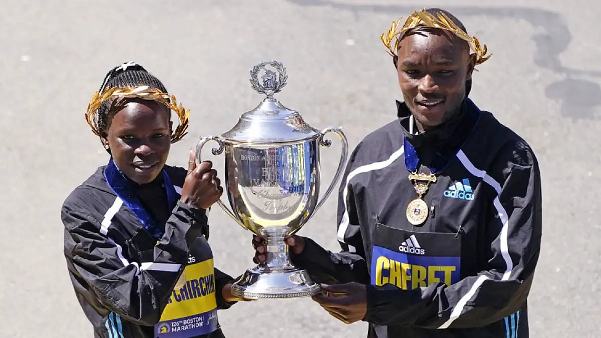Boston Marathon women's division winner Peres Jepchirchir, of Kenya, left, and men's winner Evans Ch