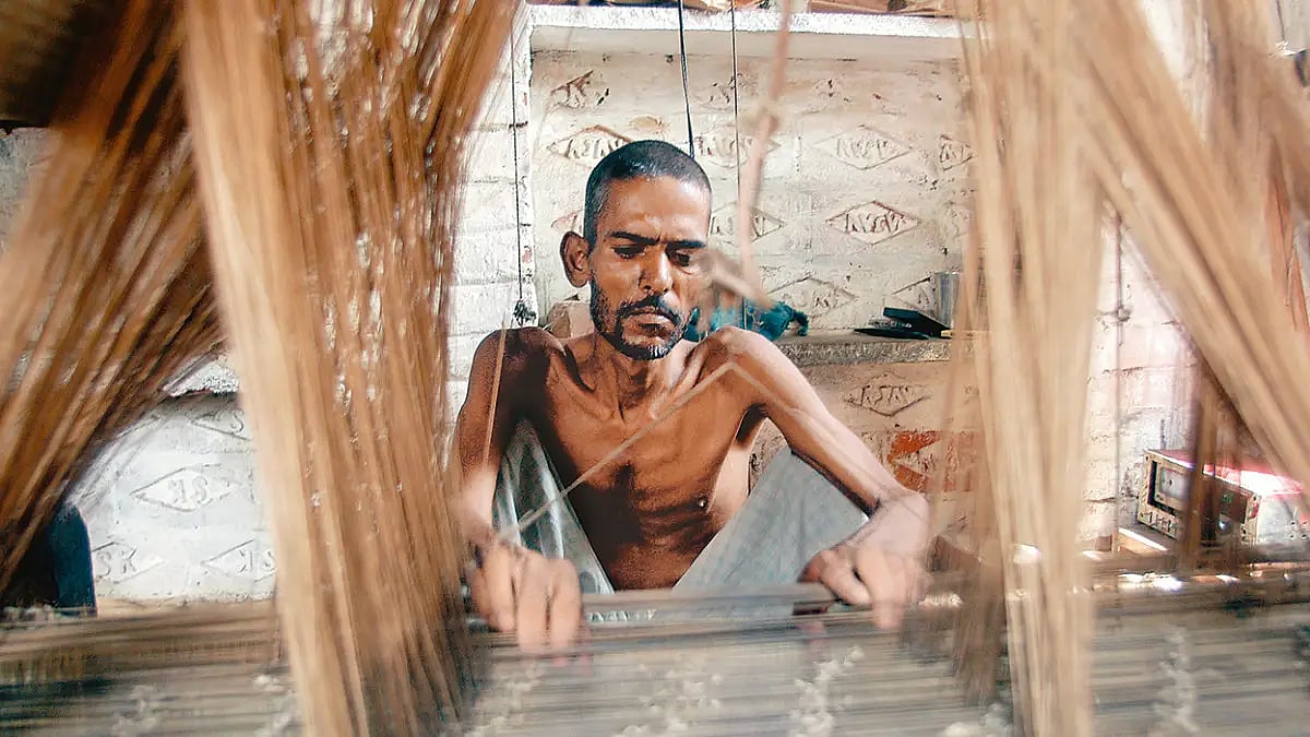 Tugging at bleak future, A malnourished textile weaver in Varanasi