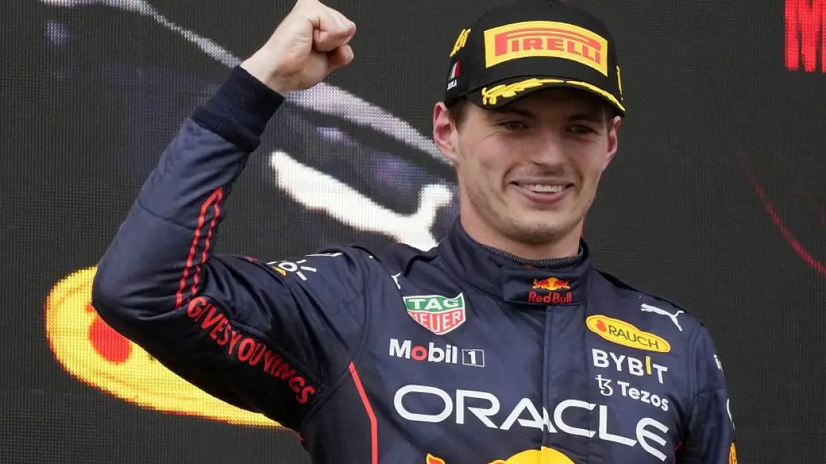 Max Verstappen celebrates on the podium after winning the Emilia Romagna Formula One Grand Prix.