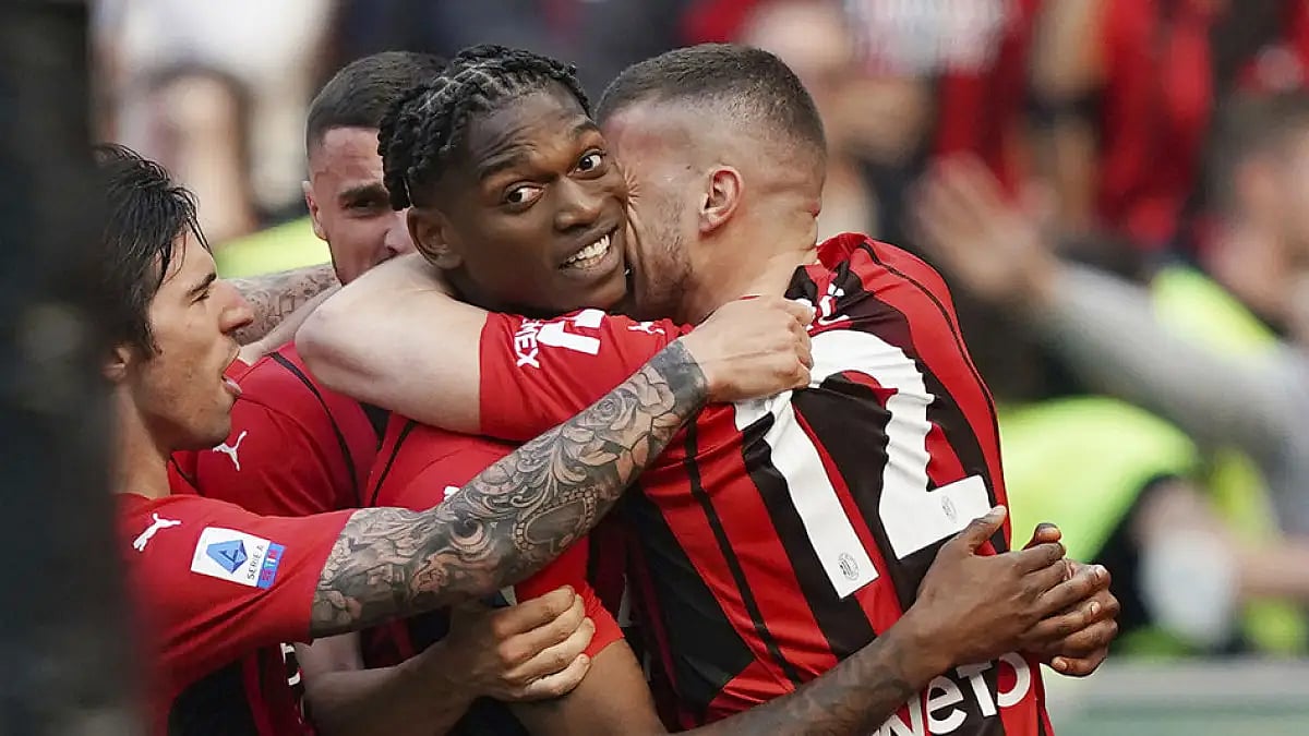 AC Milan's Rafael Leao, center, celebrates his goal against Fiorentina during their Serie A match, May 1, 2022.