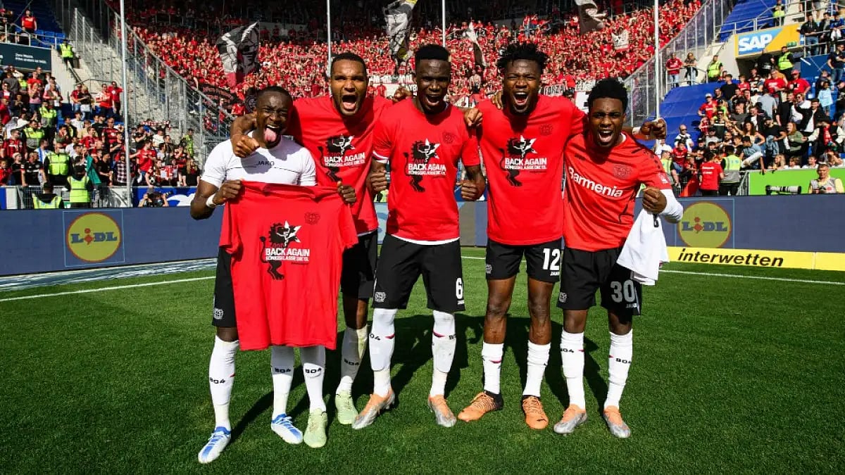 Bayer Leverkusen players celebrate after winning their Bundesliga match against Hoffenheim.