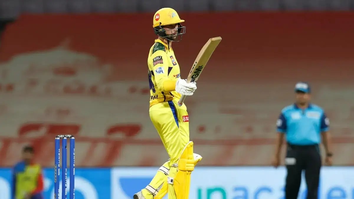 Devon Conway raises his bat after completing fifty against Delhi Capitals in an IPL 2022 match.