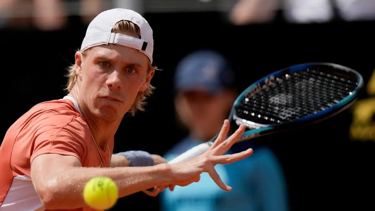 Denis Shapovalov returns the ball to Lorenzo Sonego during their Italian Open 2022 match.