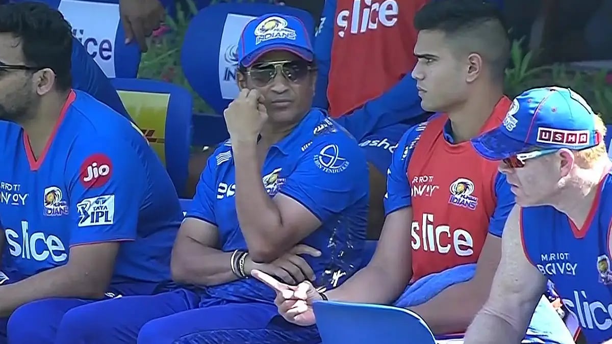 Sachin Tendulkar is seen with his son Arjun at the Mumbai Indians dugout during an IPL 2022 game. 