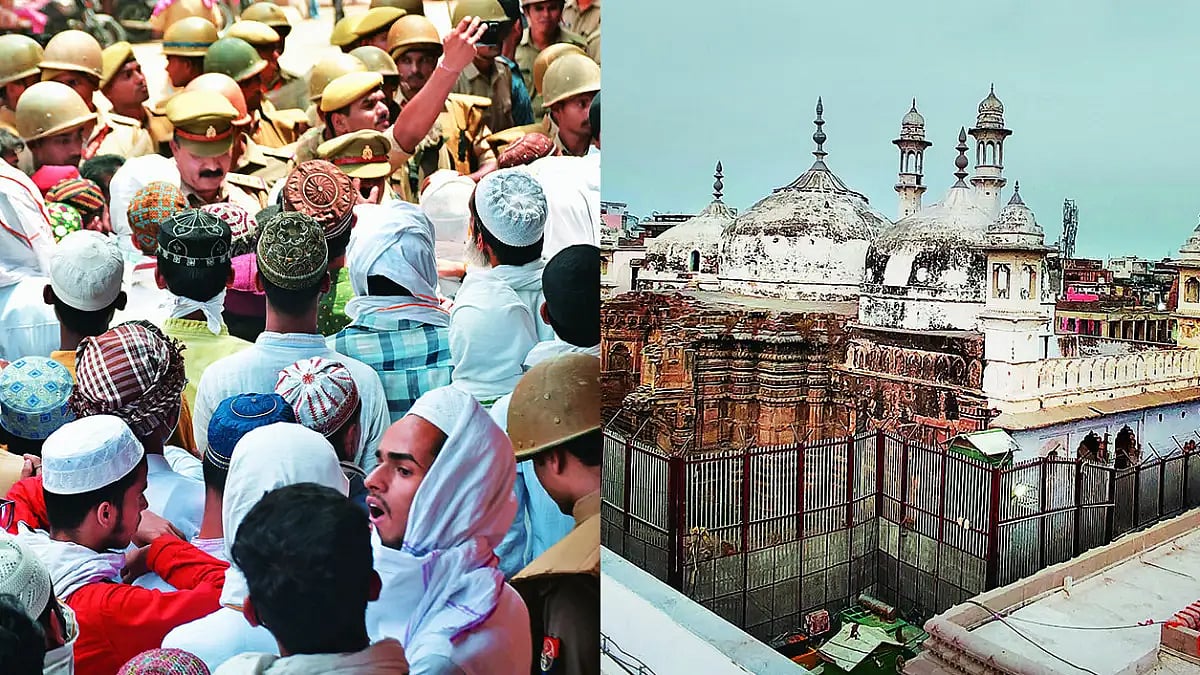 Believers Muslims enter the Gyanvapi mosque complex, seen on the right, to offer prayers. 