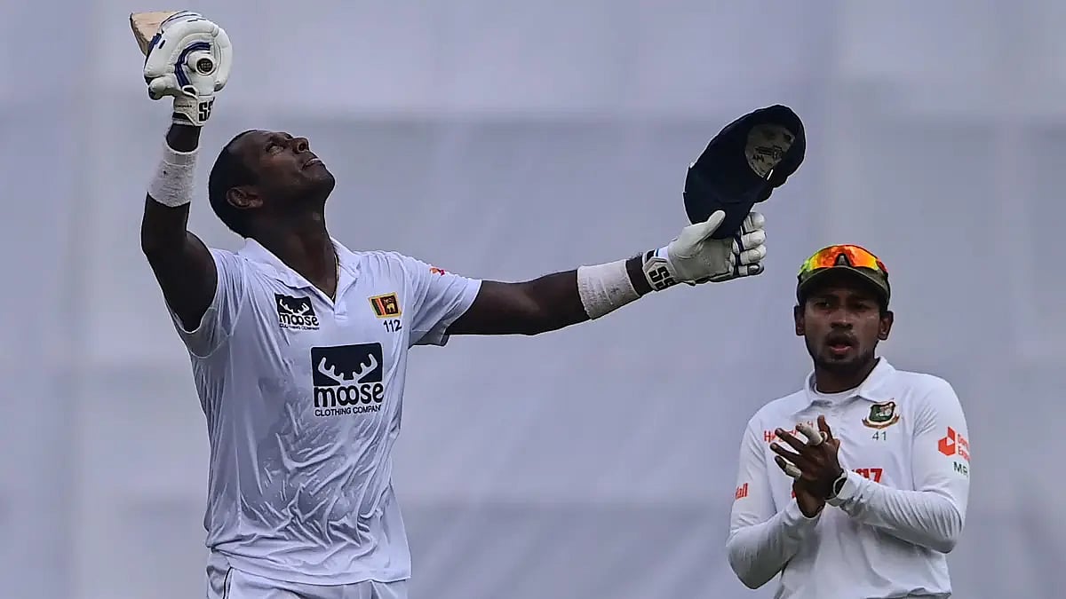 Angelo Mathews looks up to the sky after reaching his century. Get BAN vs SL Day 4 highlights.