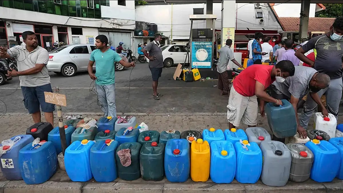 People wait for fuel as Sri Lanka faces acute shortage of essentials amid its worst financial crisis