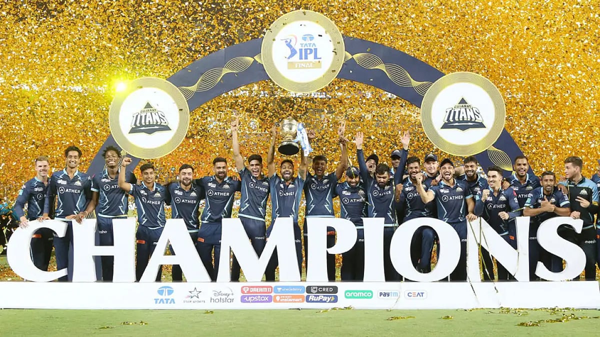 Gujarat Titans players celebrate with the IPL trophy after beating Rajasthan Royals in 2022 final, Ahmedabad, May 29. - IPL