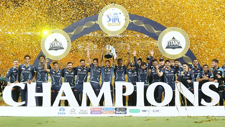 Gujarat Titans players celebrate with the IPL trophy after beating Rajasthan Royals in 2022 final, Ahmedabad, May 29. - IPL