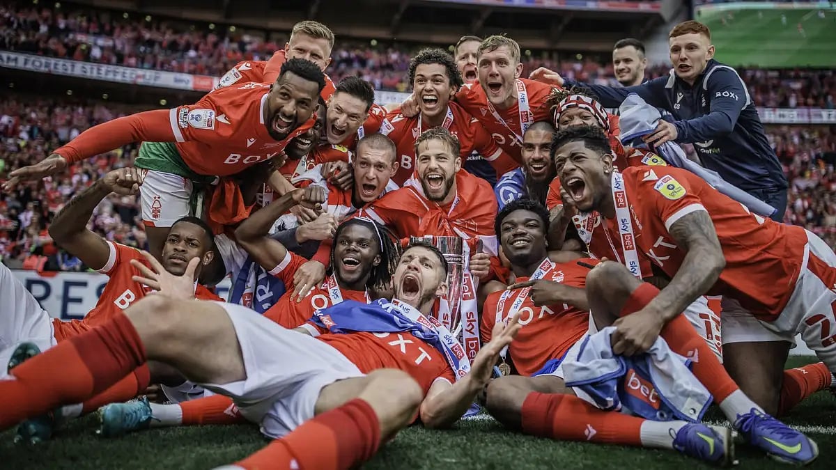Nottingham Forrest players celebrate after securing English Premier League promotion.  