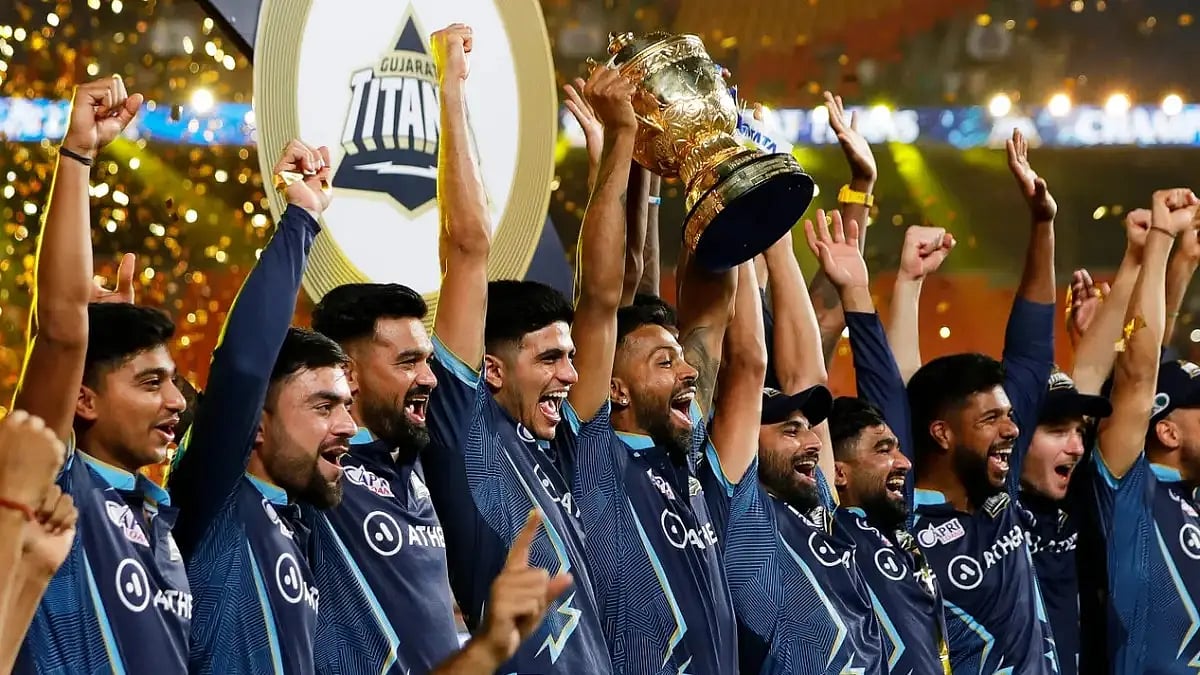 Gujarat Titans players celebrate after winning the IPL 2022 title on May 29.