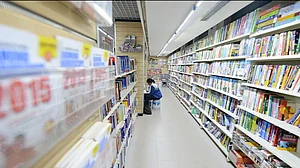 A person reading inside a library.