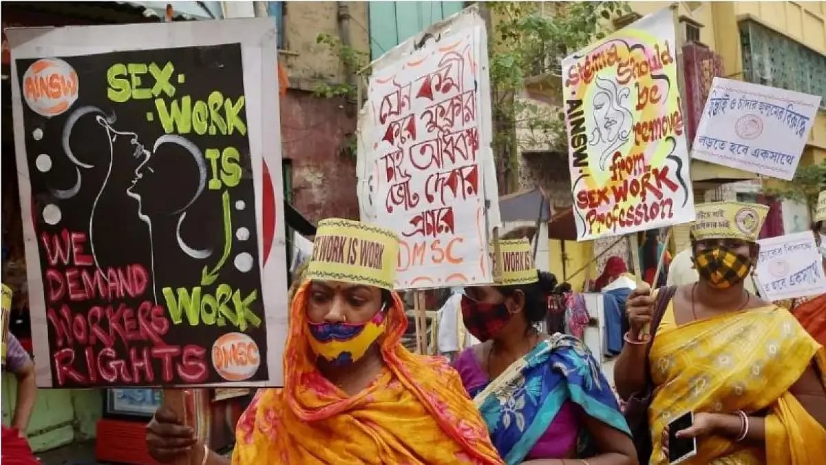 Sex workers holding banners and placards. 
