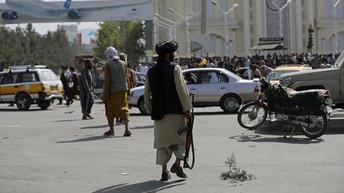 Taliban militants standing guard in front of the Hamid Karzai International Airport, in Kabul