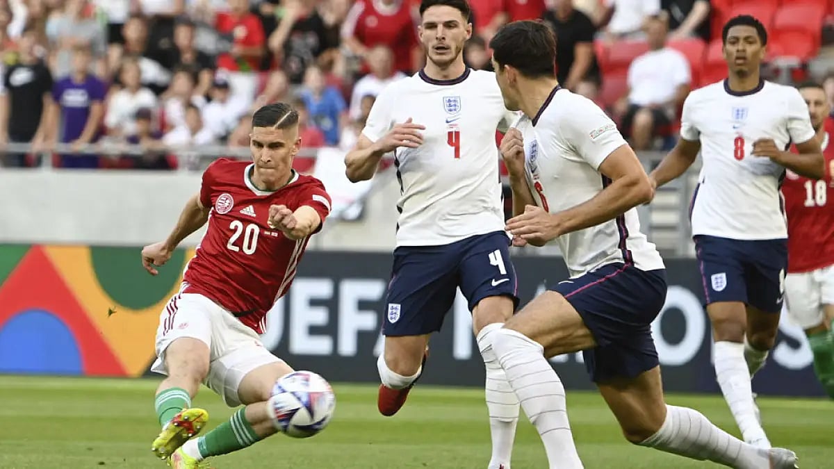Hungary's Roland Sallai, left, in action against England during their UEFA Nations League match in Budapest, June 4, 2022.