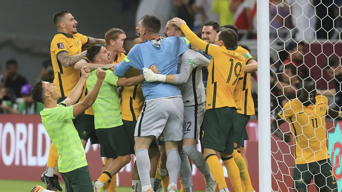 Australian players celebrate after beating Peru in the World Cup 2022 qualifying play-off in Al Rayyan, Qatar, June 13, 2022.