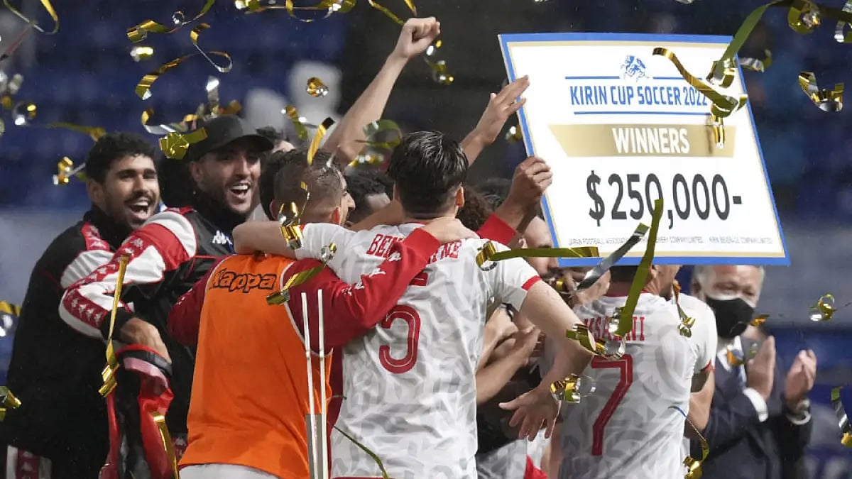 Tunisian players celebrate after winning the Kirin Challenge Cup 2022 in Suita, Japan, June 14, 2022.