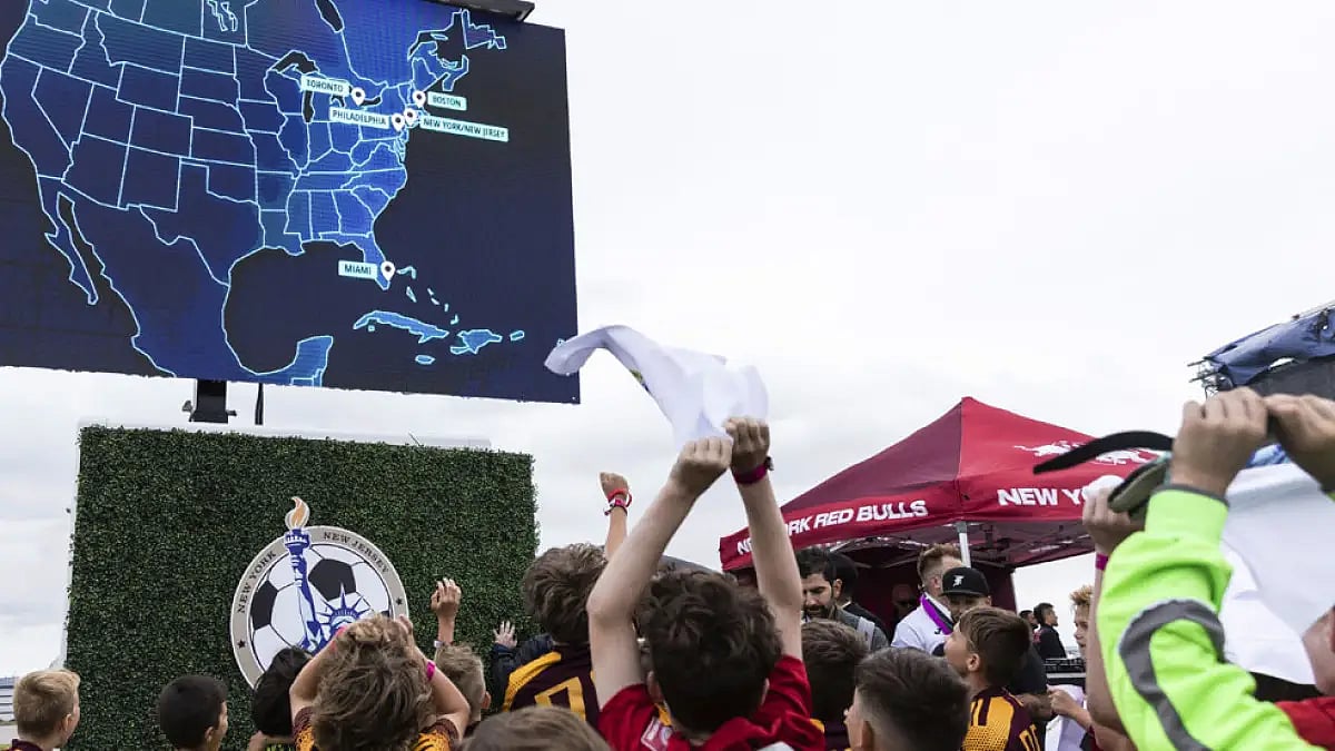 Children react to the announcement that East Rutherford, N.J., will be a FIFA World Cup 2026 host city.