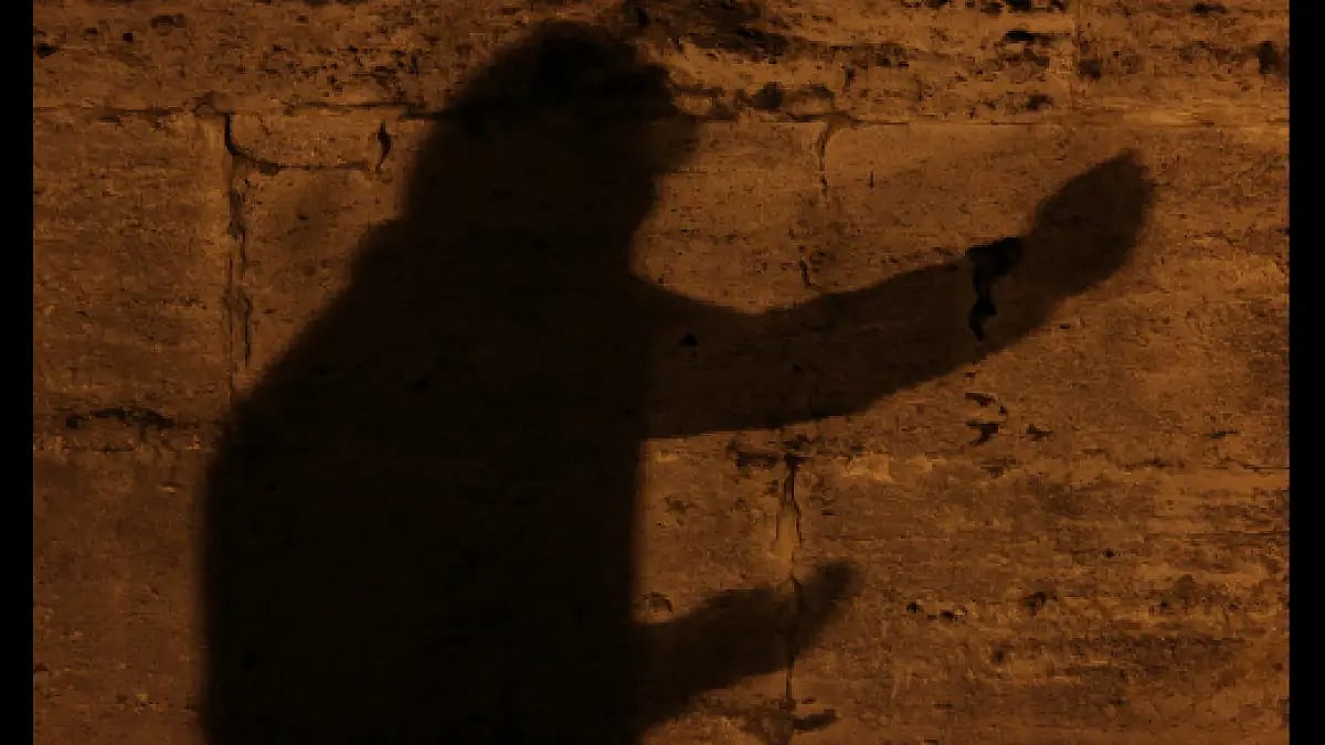 Praying silhouette.
