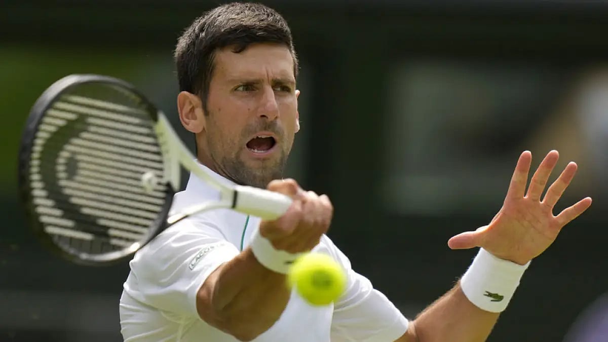 Novak Djokovic in action against Thanasi Kokkinakis during their Wimbledon 2022 match.